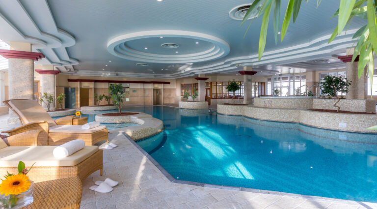 Indoor pool at Slieve Russell Hotel Golf & Country Club with loungers