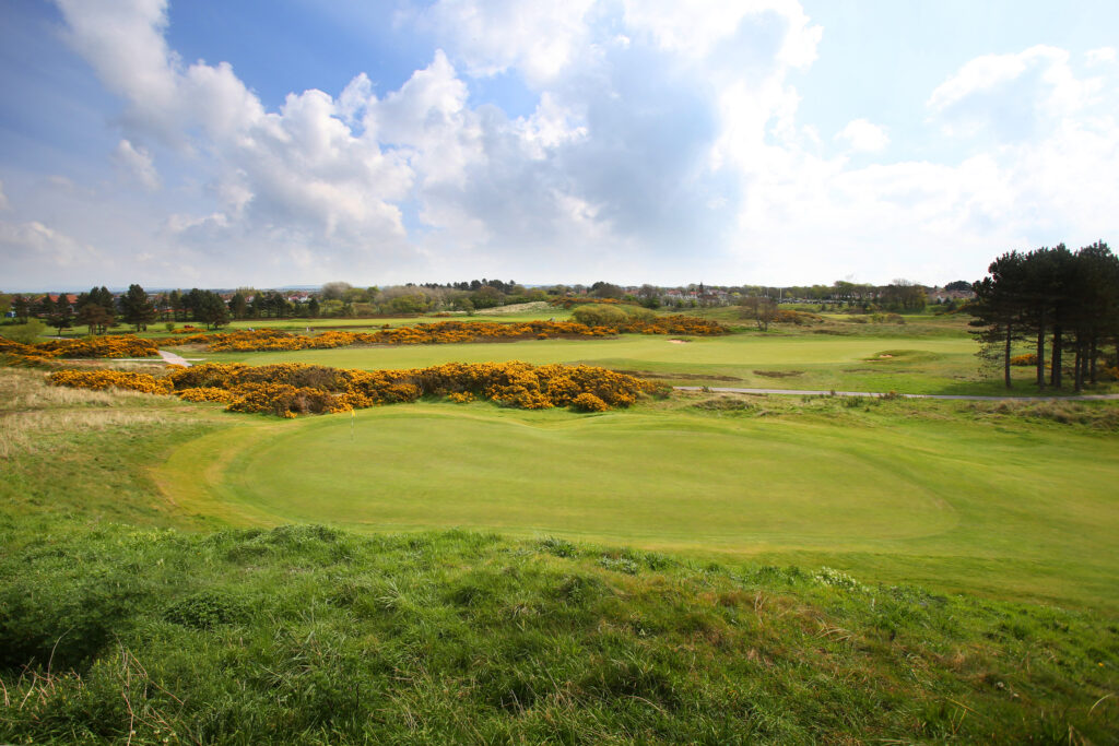 Hole with yellow foliage around and trees in backkground at Southport & Ainsdale