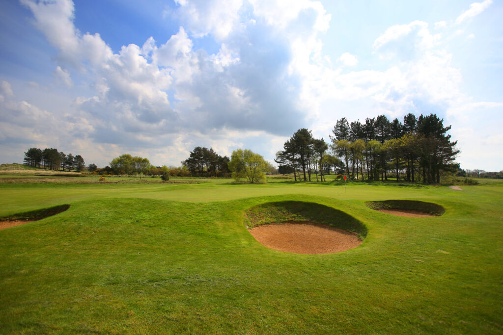 Hole with bunkers with trees around at Southport & Ainsdale