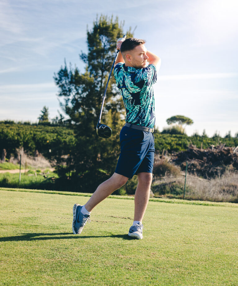 picture of a golfer on a golf course after hitting the ball