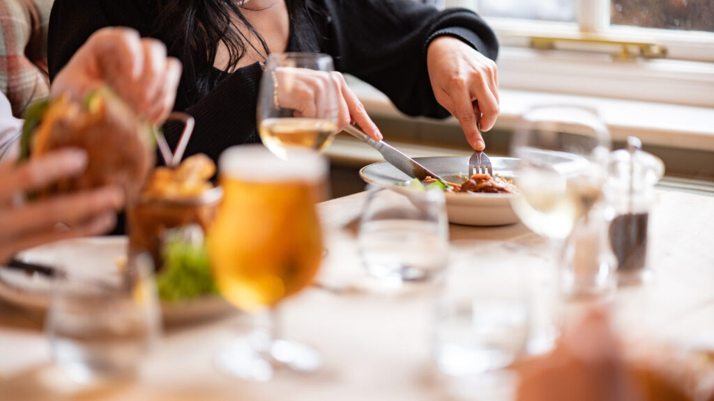 People eating at The Bell Inn & Bramshaw Golf Club