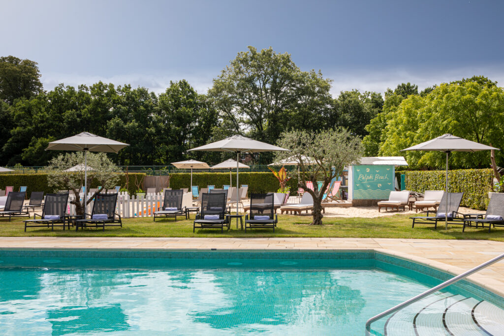 Outdoor pool at The Grove with sun loungers