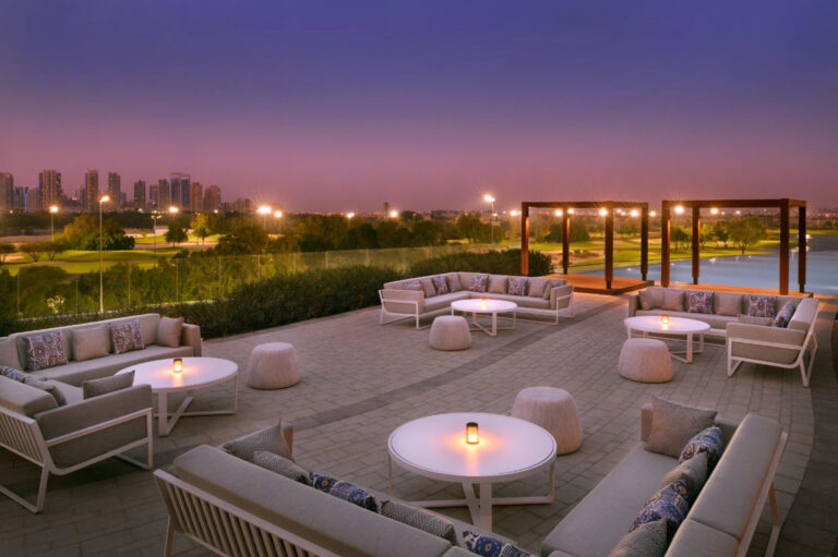 Outdoor seating area at Vida Emirates Hills at night