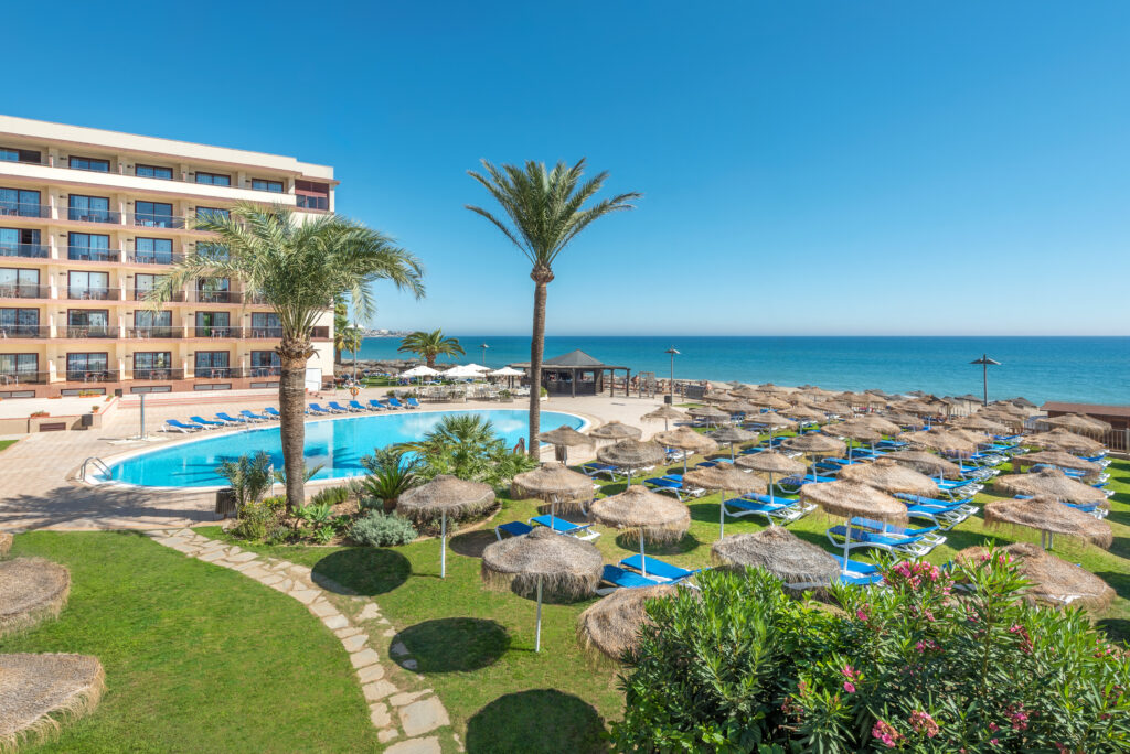 Outdoor pool with sun loungers at Vik Gran Hotel Costa del Sol