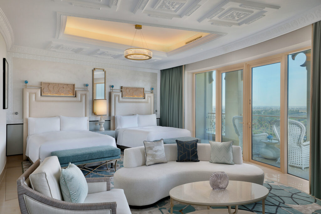 Twin bed accommodation at Waldorf Astoria Ras Al Khaimah with seating area