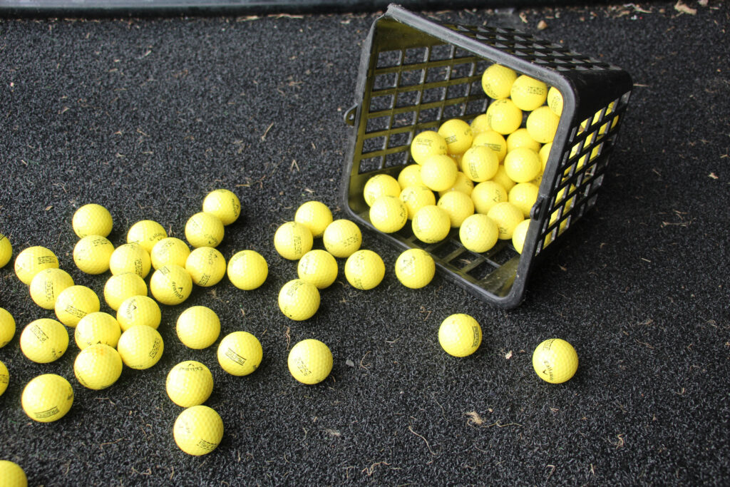 Driving range balls spilling out of basket at Whittlebury Park Golf Course