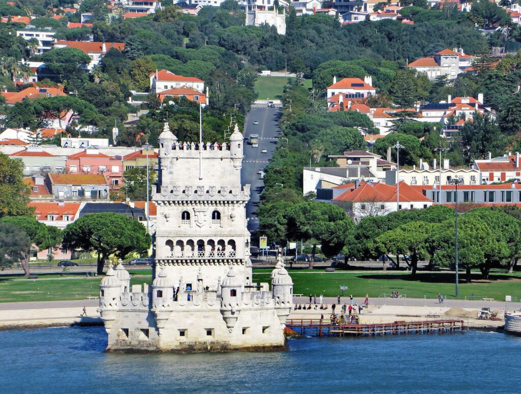 a white castle on the water in lisbon