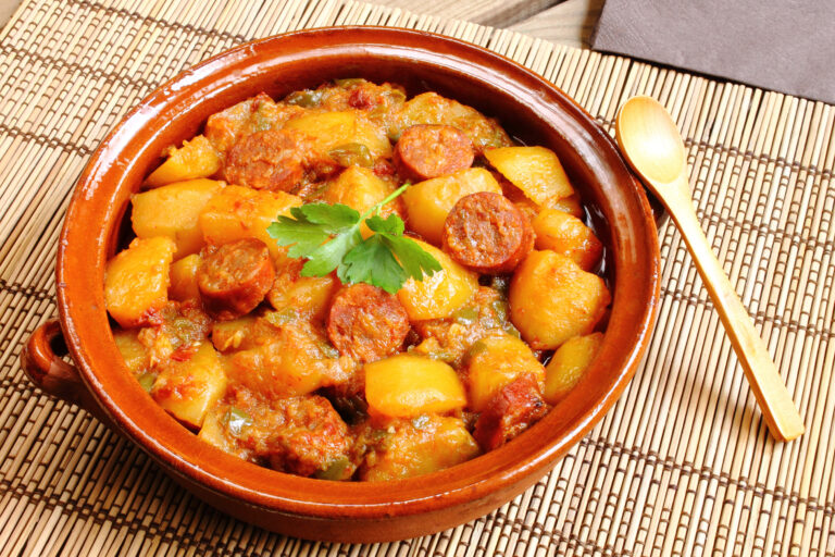 a plate of potatoes with spanish sausage