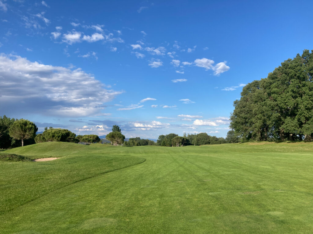 Fairway at Rioja Alta Golf Club with trees around