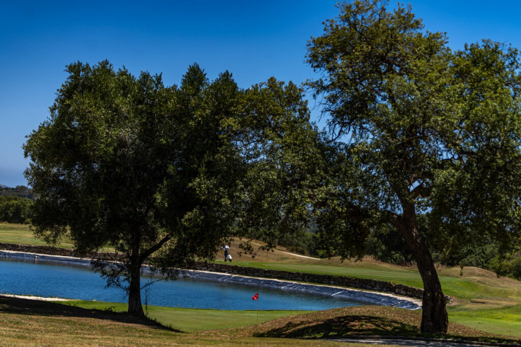 Trees and lake on fairway at San Roque Golf & Resort