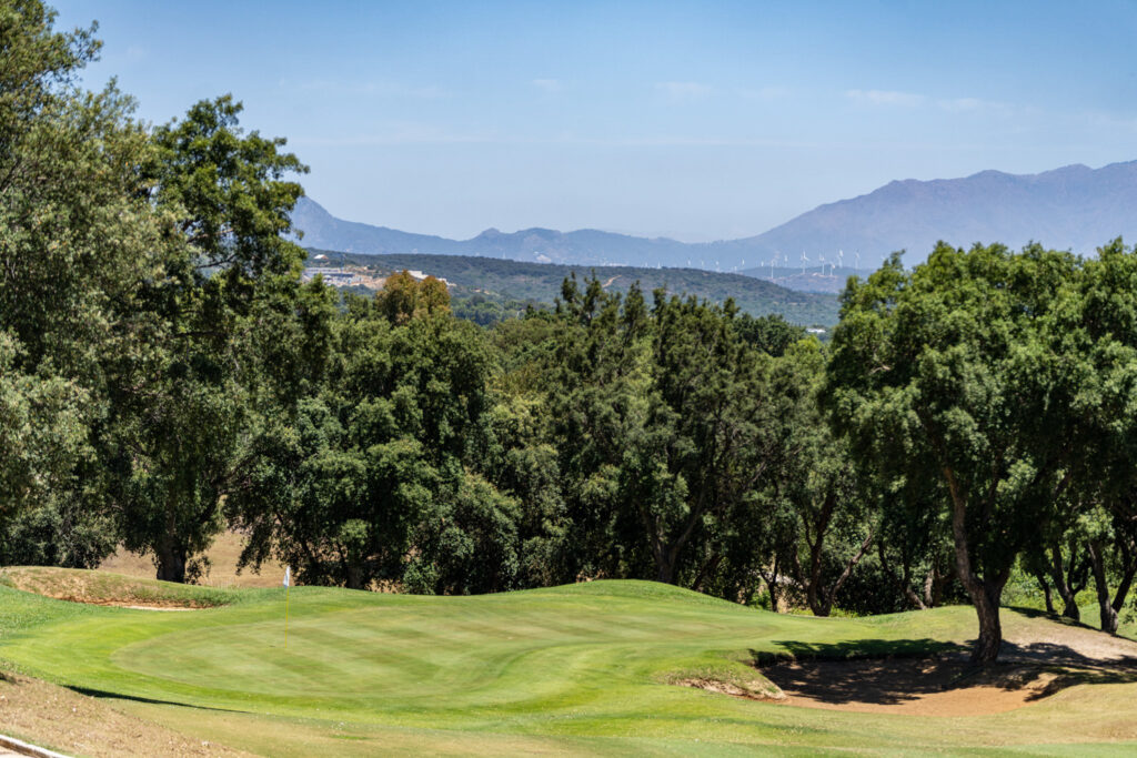 Fairway with bunkers and trees around at San Roque Golf & Resort