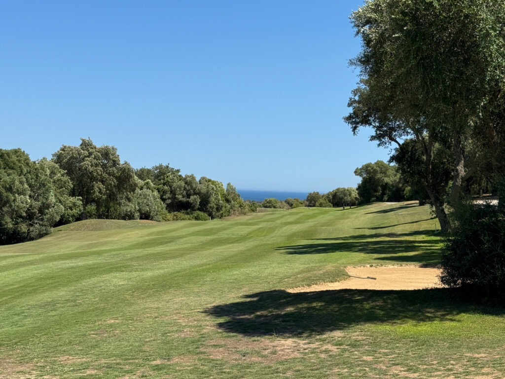 Fairway with trees around at San Roque Golf & Resort