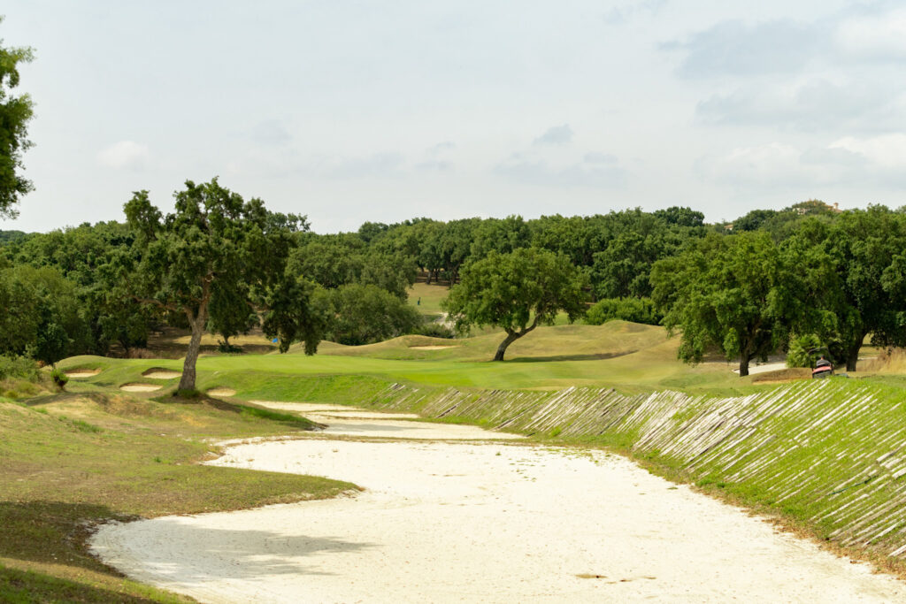 Bunkers on fairway at San Roque Golf & Resort with trees around